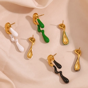 Detail of colorful drip glaze earrings with irregular fluid shapes in 18K gold plated finish
