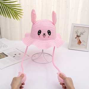 Pink straw rabbit hat for kids with moving ears and cute cartoon embroidery detail