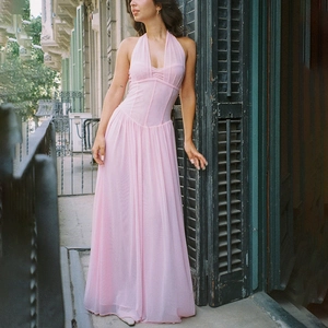 Pink halter neck pleated maxi dress with elegant V-neckline and waist tie detail