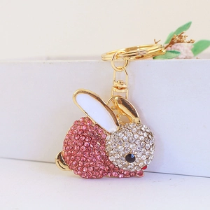Porte-clés lapin en strass rose et blanc avec fermoir mousqueton en métal doré