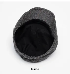 Detail view of the herringbone wool flat cap interior lining and elastic adjustment