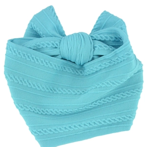 Close-up of light blue soft nylon baby headband with textured knit pattern and large bow