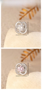 Macro detail of 9mm four-leaf clover stud earrings with cubic zirconia and silver plating