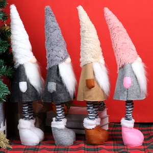 Set of four plush Christmas gnomes with telescopic legs on a festive red background