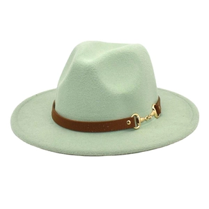 Detail of mint green wool fedora hat featuring brown leather band and gold metal buckle