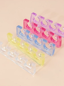 Detailed view of colorful glitter silicone toe separators for professional nail art care