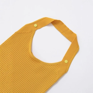 Sexy yellow ribbed knit halter top with bright green button accents on white background