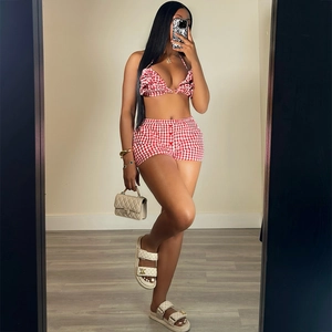 Women's summer red gingham two-piece set with ruffled halter crop top and matching shorts