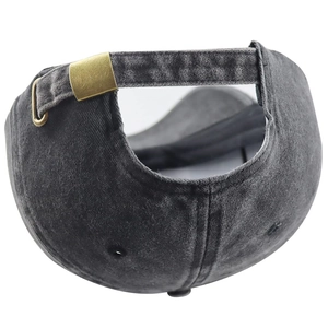 Detailed close-up of the vintage washed cotton cap with an adjustable bronze metal buckle