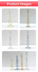 Macro shot of colorful art glass candle holders in amber, pink, and green tones