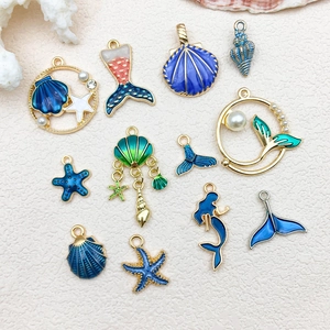 Detailed collection of blue and gold ocean-themed alloy charms for DIY jewelry making