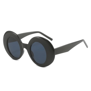 Vintage oversized round thick black frame sunglasses with dark lenses on white background