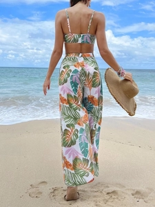 Rear view of tropical leaf print beach set featuring a crop top and mesh wide-leg pants