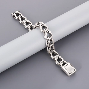 Detail of vintage punk stainless steel chain bracelet with interlocking handcuff links