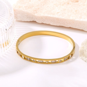 Elegant 18K gold-plated titanium steel bangle with round and square zircon stones