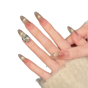 Long almond press-on nails with brown gradient, gold glitter and large rhinestone