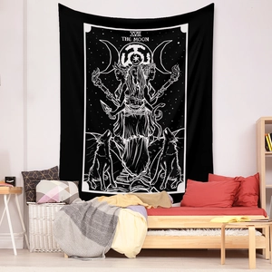 Detailed view of black and white Tarot Moon tapestry hanging on a minimalist bedroom wall