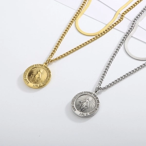 Gold and silver layered necklaces with snake chain and Miraculous Medal coin pendant