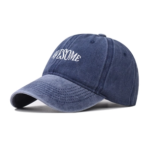 Navy blue washed cotton baseball cap with white AWESOME embroidery from a 45-degree angle