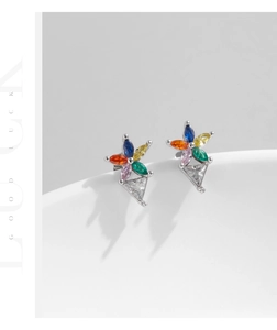Detail view of S925 sterling silver flower earrings with colorful rainbow gemstones