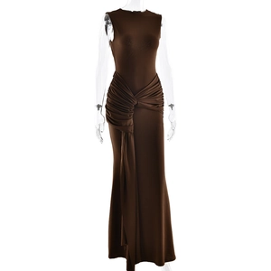 Detail of elegant dark brown sleeveless dress featuring ruched waist and side drape design