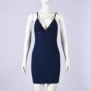 Detail of dark blue floral lace fabric on a slim-fit bodycon mini dress