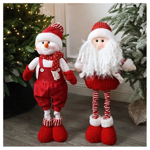 Detail of plush Christmas gnomes featuring telescopic legs and festive red knitted outfits
