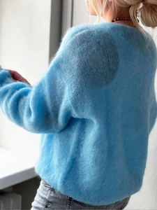 Sky blue knit sweater for women with soft fluffy texture and relaxed casual fit style