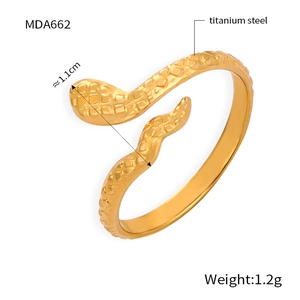 Detailed view of gold titanium steel snake ring with texture and 1.1cm width measurements