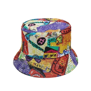Detail view of colorful graffiti bucket hat featuring bold pop art patterns and vibrant prints