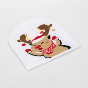 Close-up of white knit beanie featuring a cute cartoon reindeer with a red holiday hat