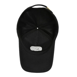 Interior view of black cotton baseball cap with adjustable gold buckle and white label