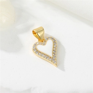 Detailed view of 14K gold plated heart pendant with red shell inlay and zircon accents