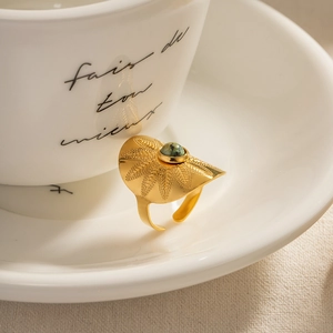 Vintage wide gold ring with engraved leaf patterns and a green turquoise stone inlay