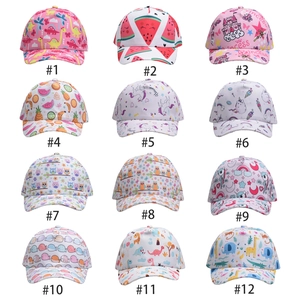 Collage of kids baseball caps featuring various cartoon dinosaur and unicorn patterns