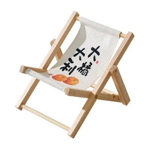 Miniature wooden folding beach chair phone holder with artistic orange print design