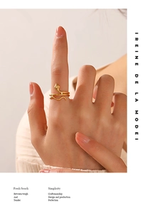 Detailed view of an 18K gold-plated stainless steel snake ring with textured scales