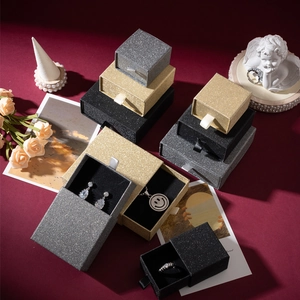 Detailed view of glitter jewelry gift boxes in gold and silver for rings and earrings