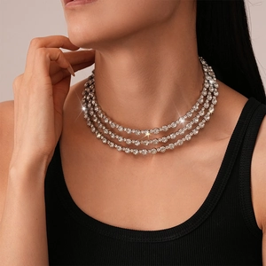 Close-up of triple-layered silver choker necklace with sparkling round-cut crystals