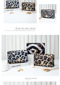 Detail of animal print chain crossbody bag showing leopard pattern and gold metal buckle