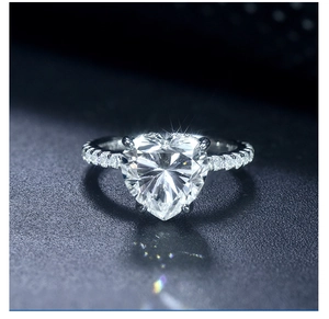 Macro shot of 925 sterling silver ring with heart-cut moissanite and micro-pave setting