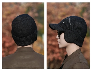 Detail view of winter knitted cap with ear flaps and EYALA logo in outdoor setting