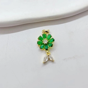 Exquisite gold flower pendant with green and white zircon crystals on white background