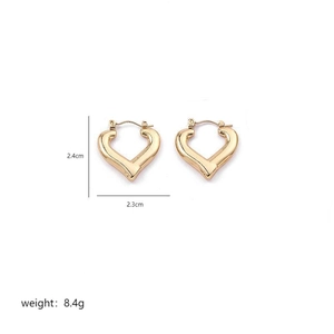 Detail shot of heart-shaped gold hoops showing dimensions 2.4cm by 2.3cm and 8.4g weight