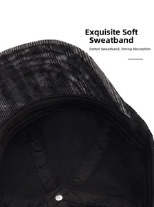 Close-up of internal soft cotton sweatband and stitching on a black corduroy baseball cap