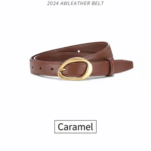 Caramel leather belt for women with a stylish irregular golden buckle on white background