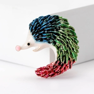 Fashionable enamel hedgehog brooch featuring vibrant blue and red gradient metal spikes