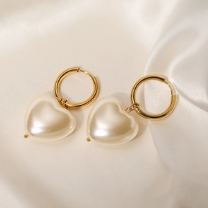Elegant 18K gold plated hoop earrings with white heart pearls on white silk