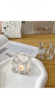 Macro shot of an ice cube textured crystal glass candle holder on a modern dining table