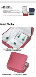 Detail view of multi-compartment PU leather jewelry box with necklace hooks and ring slots